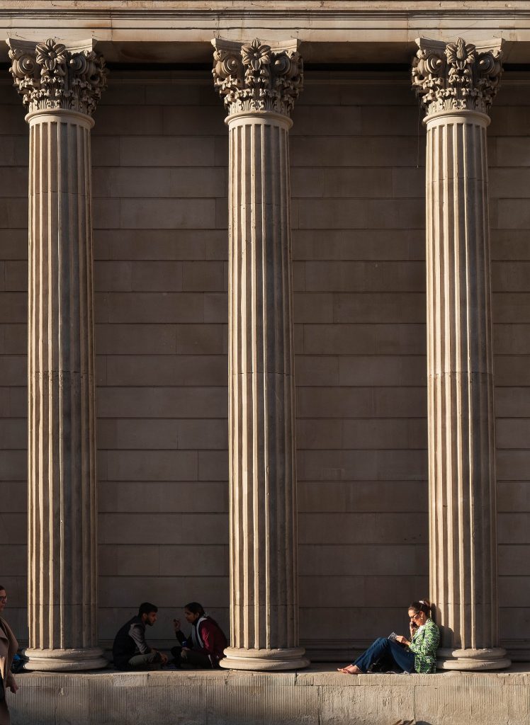 Digital Money Grows Up: Stablecoins and Central Banks Golden cryptocurrency coins arranged on a dark surface