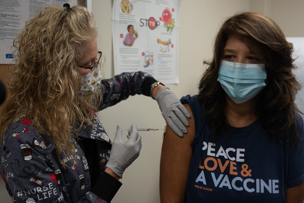 Understanding the Latest Rise in US Measles Cases A healthcare worker preparing a measles vaccination dose